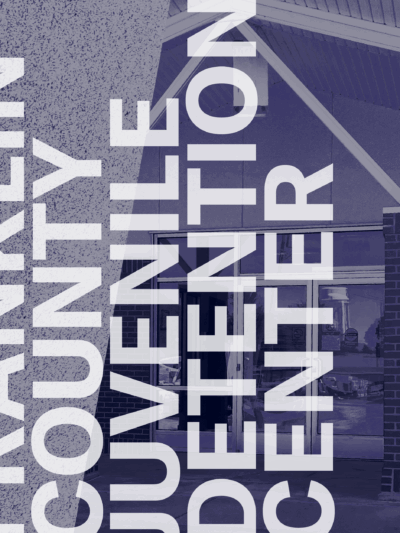 White text Franklin County Juvenile Detention Center. Behind navy filtered image of the front of the building.