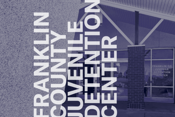 White text Franklin County Juvenile Detention Center. Behind navy filtered image of the front of the building.