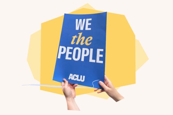 Hands holding "We the People" sign over yellow geometric shapes