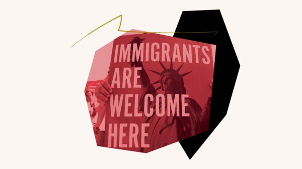 Red filtered image of "Immigrants are Welcome Here" poster