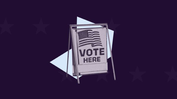 Purple background, purple filtered "vote here" sign