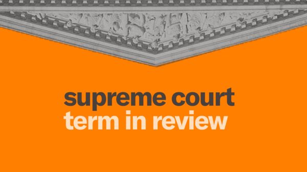Orange background. Upside down SCOTUS building at the top of the image. Gray and white text "supreme court term in review"