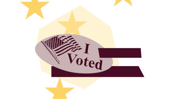 Light pink shape with yellow "I voted" sticker