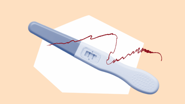 Orange background with blue filtered pregnancy test