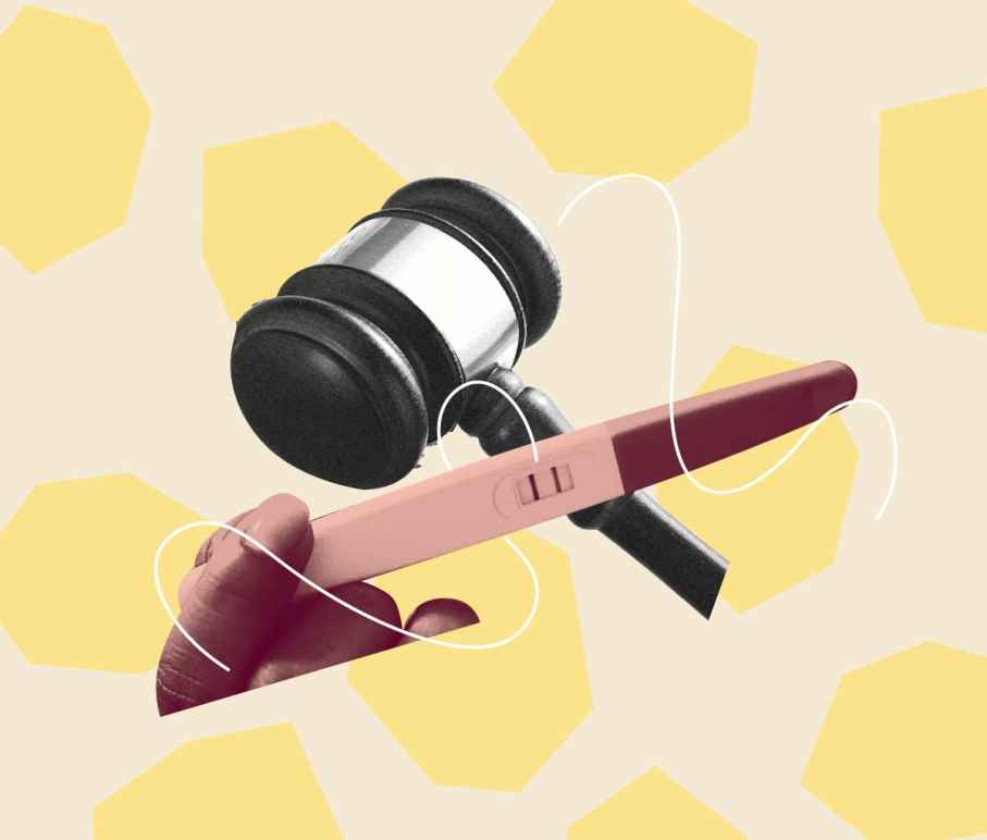 Pink hand holding a pregnancy test over a black and white gavel. Background is beige with light yellow geometric shapes