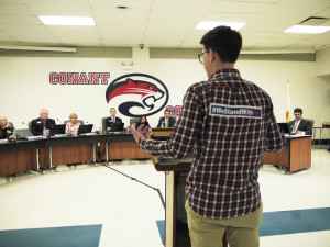 The District 211 School Board listens to comments from a transgender student at a December board meeting