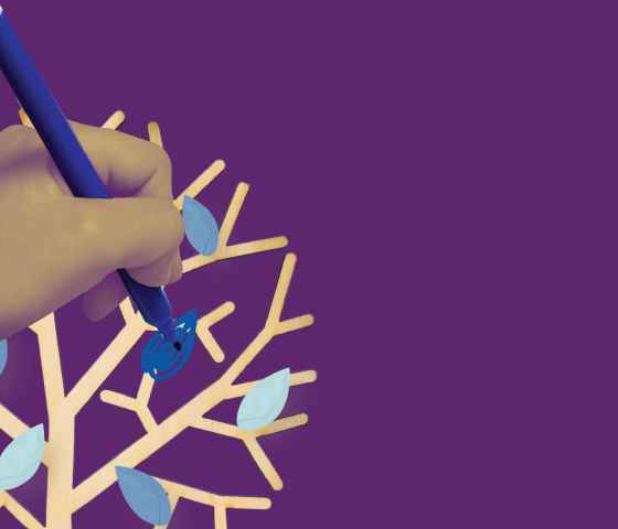Child hand coloring in a blue leaf on a tree over a purple background